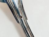 a spoon and fork on a table with a white background