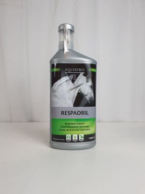 a bottle of liquid sitting on top of a white table
