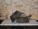 an old tea kettle sitting on top of a table