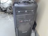 a computer tower sitting on the floor next to a wall