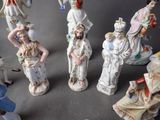 many figurines of different sizes and colors on the table