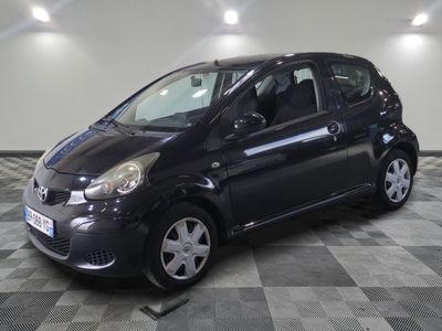 a picture of a small black car on a checkered floor