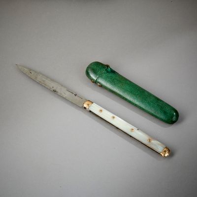 a knife and a knife sharper on a table