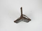 a small metal object that is on a white surface