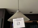 a light that is hanging from the ceiling in the room