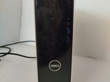 a dell desktop computer sitting on a white surface