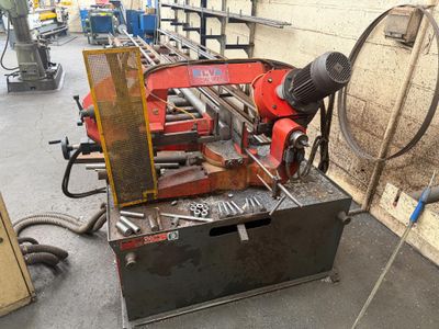 a machine that is working on a piece of wood