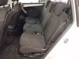 a white car with black seats in the back of it