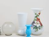 three vases that are sitting next to each other on a table