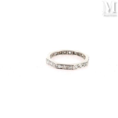 a close up of a diamond ring on a white background