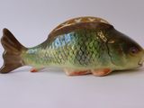 a small fish figurine that is sitting on a table