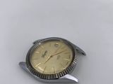 a watch sitting on top of a white table