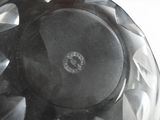 a close up of a glass vase with a black base