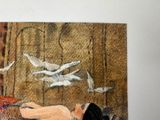 a painting of a woman laying on a bed with birds flying overhead