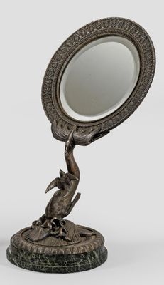an image of a bronze statue of a person holding a mirror