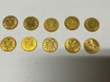 a bunch of gold coins sitting on top of a table