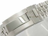 a close up of a watch bracelet on a white surface