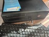 a desktop computer and a keyboard on a desk