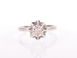 an image of a diamond ring on a white surface