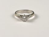 a white gold engagement ring with a heart shaped diamond