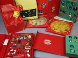 a lot of toys in a red box on a table