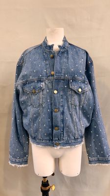 denim jacket with white polka dots on the sleeves and cuffs