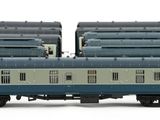 three blue and white train cars sitting next to each other on a white surface
