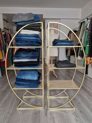 a rack with jeans on it in a store