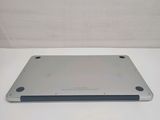 the back side of a silver ipad with a white background