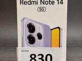 a box of redmi note 14 is shown on a table