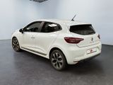 the rear end of a white car in a showroom