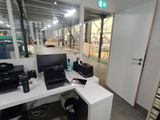 a desk with a computer and a printer on it
