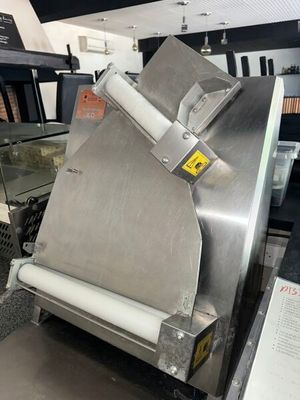 a machine that has a roll of paper on it