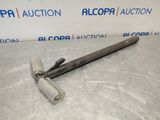 a large metal hammer with a long handle sitting on top of a plastic sheet