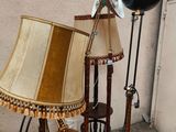 a lamp that is next to a table with a lamp on it