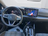 the interior of a car with a steering wheel, dash panel, and a touch screen