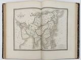 an open book with a map of the world on it