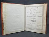 un vieux livre ouvert sur une page où l'on peut lire quelque chose