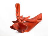 a red sculpture that is sitting on top of a table