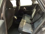 the back seats of a car with a seat belt in a car