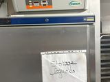 an image of a refrigerator with a sign on it