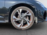 a close up of a car ' s wheel on the street