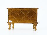 a small wooden chest with a diamond pattern on it