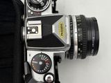 a camera that is sitting on a table with a case