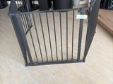a baby gate in the middle of a room
