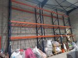 a large warehouse with a lot of items on the shelves