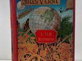 an old book with a picture of a globe on the cover