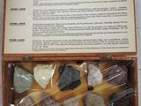 a wooden box with rocks in it on a table