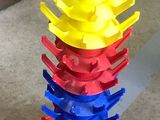 a stack of plastic spoons sitting on top of a plastic plate