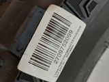 someone is holding a tire with a barcode on the side of it